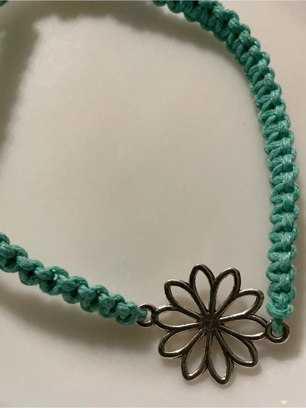 Pretty blue floral charm string bracelet